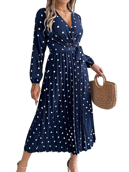 Cross V-neck pleated maxi dress in blue– close-up of contrast color bodice and polka dot fabric pattern
