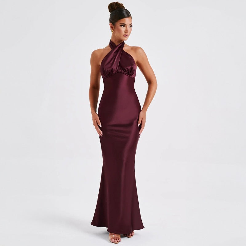 Halter neck formal gown in burgundy  with empire waist and floor-length skirt

