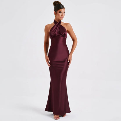Halter neck formal gown in burgundy  with empire waist and floor-length skirt

