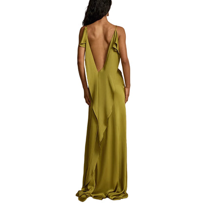 Woman wearing a green evening gown with a deep back 