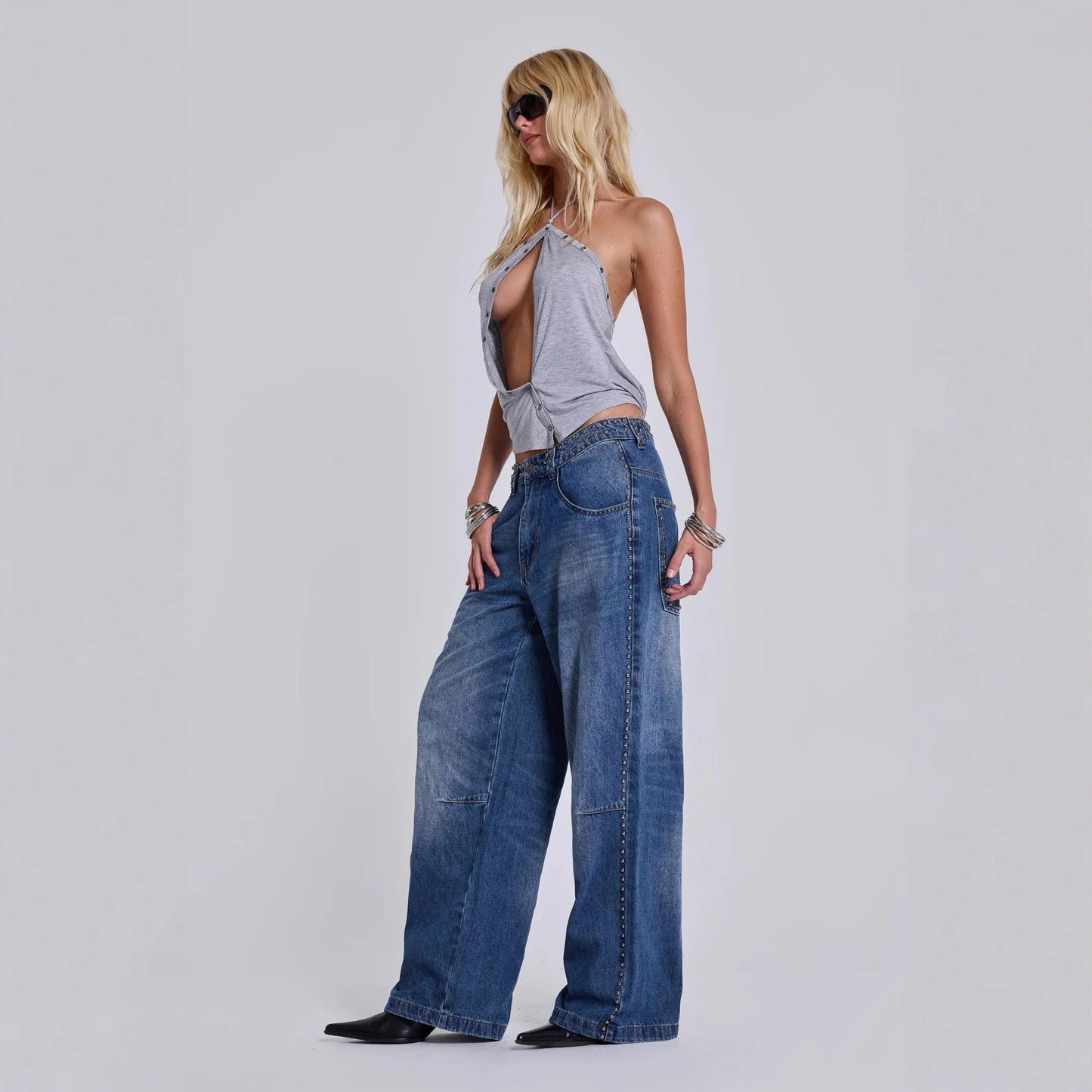 Loose baggy jeans for women showcasing relaxed fit and decorative beadwork

