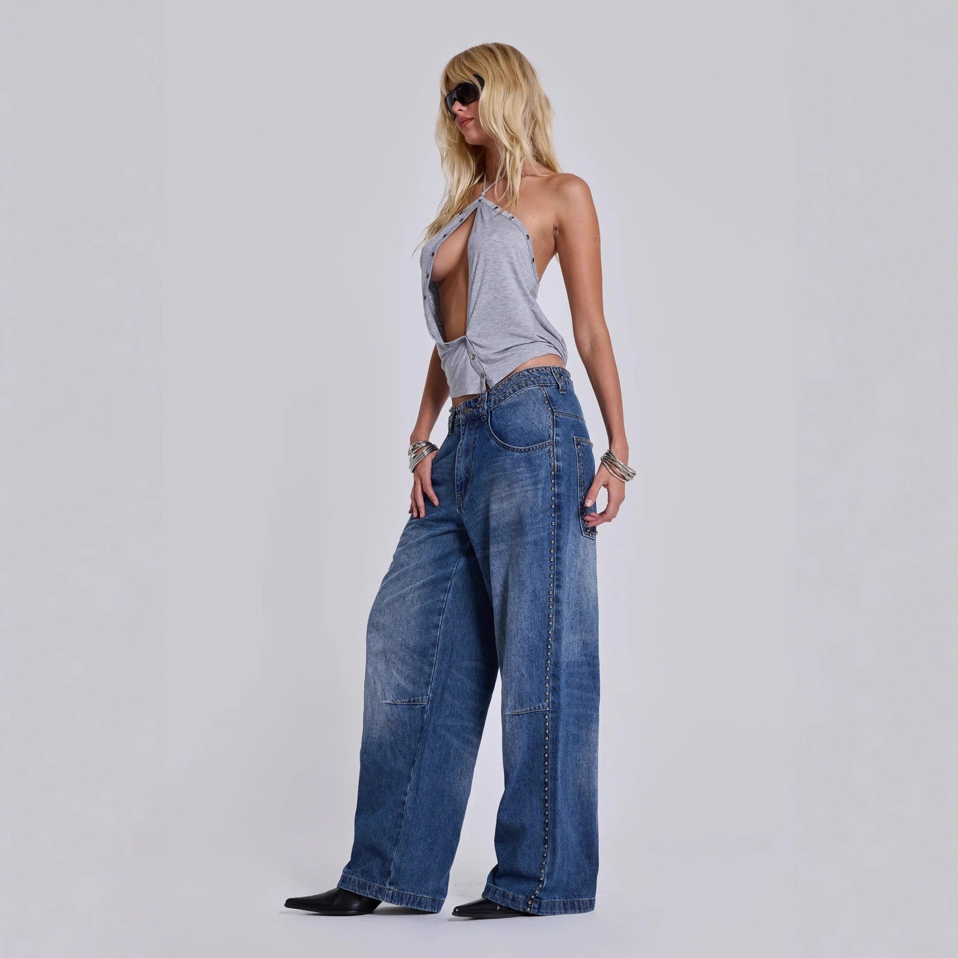 Loose baggy jeans for women showcasing relaxed fit and decorative beadwork

