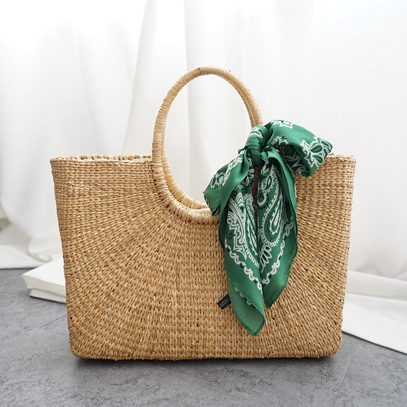 Woven bag with a green bandana 