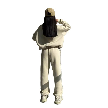 Women's Y2K zip-up jacket and trousers set in apricot – side view showing relaxed fit and contrast stitching
