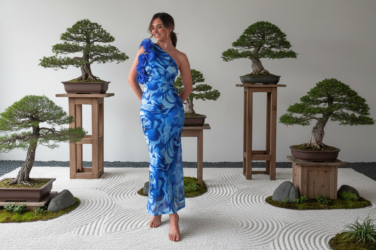 Woman wearing a blue floral one-shoulder silk elegant  one shoulder dress  