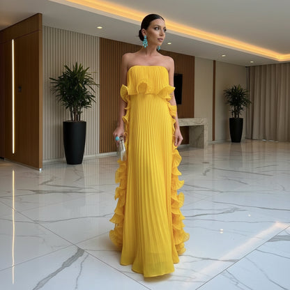 Yellow strapless pleated ruffle chest wrap maxi dress – front view, tiered ruffle side panels and floor-length hem