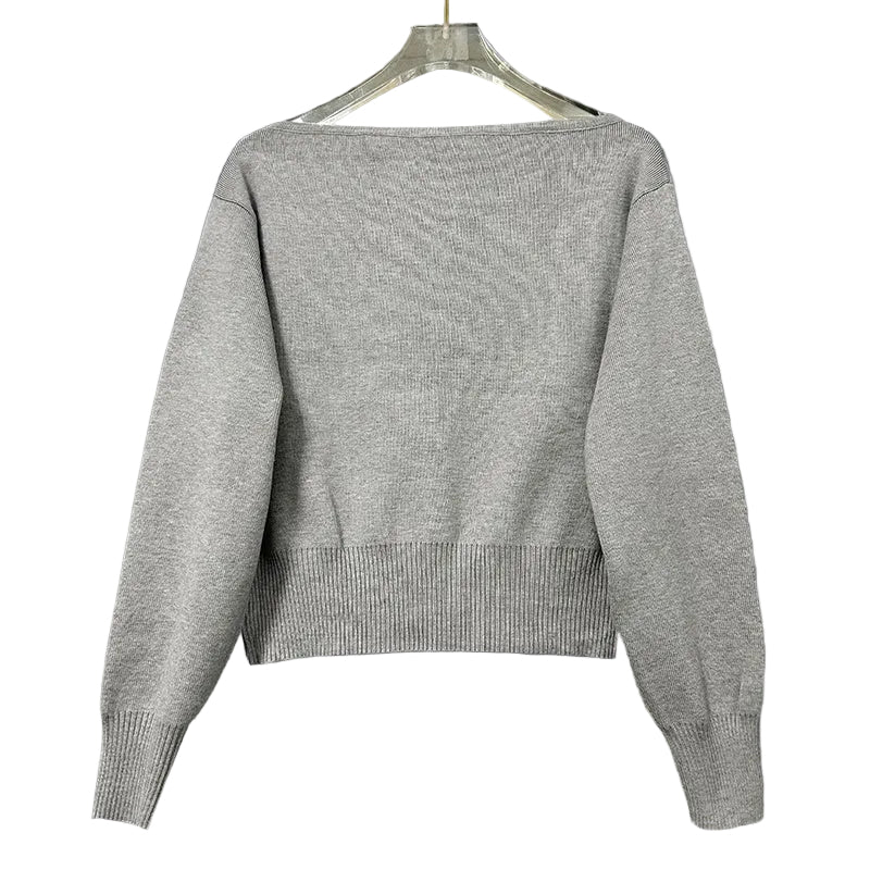 Gray sweater on a hanger 