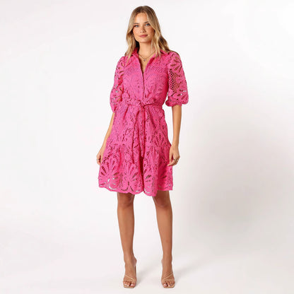 Woman wearing a pink lace dress 
