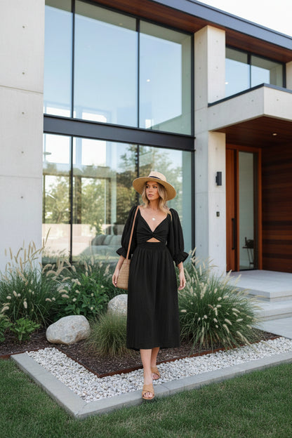 Reversible V-neck lantern sleeve midi dress in black– front view showing three-quarter sleeve and mid-length hem
