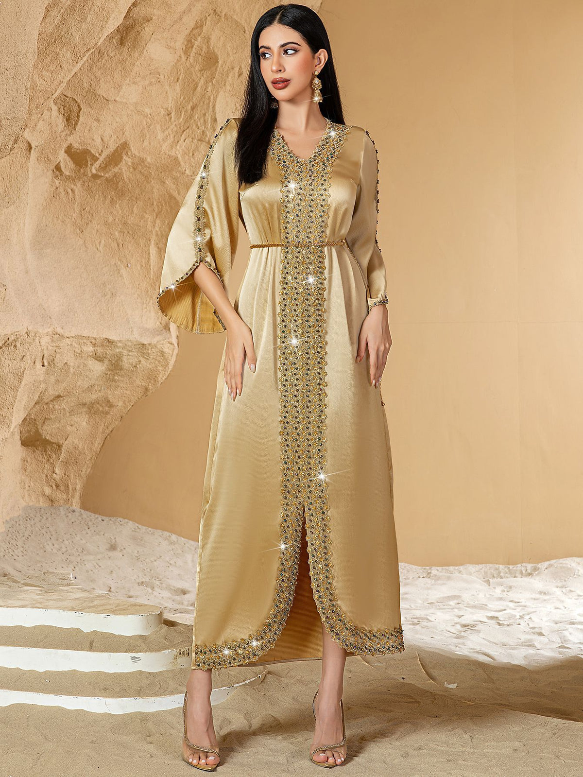Woman wearing a gold dress Embellished Satin Kaftan Abaya 