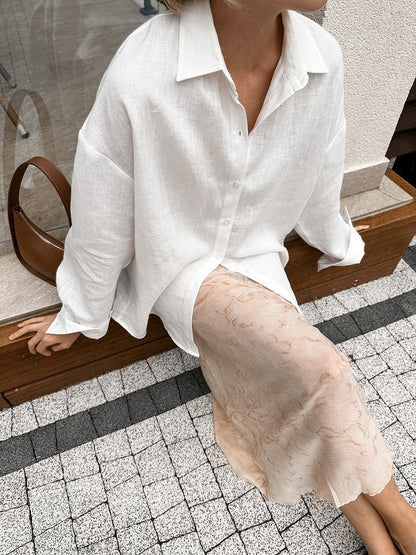 Flat lay of women's loose cardigan blouse in white – solid color polyester top S–XL
