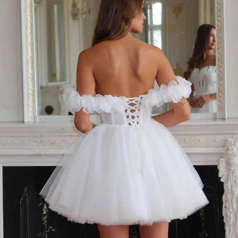 Bride wearing a short ivory lace off-shoulder wedding dress for elopement

