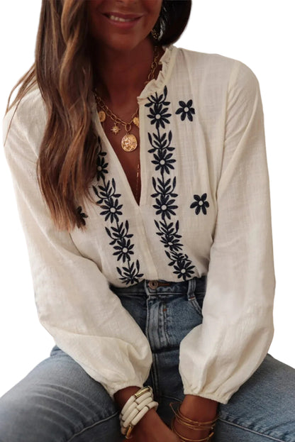 White frilled V-neck blouse with puff sleeves – side view showing loose fit silhouette
