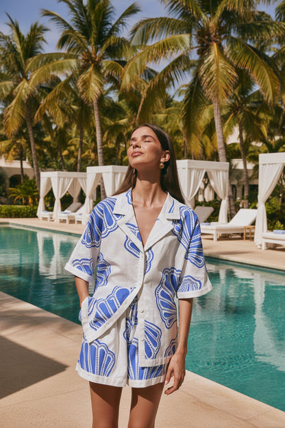 White and blue linen printed matching set styled for beach resort — relaxed casual outfit
