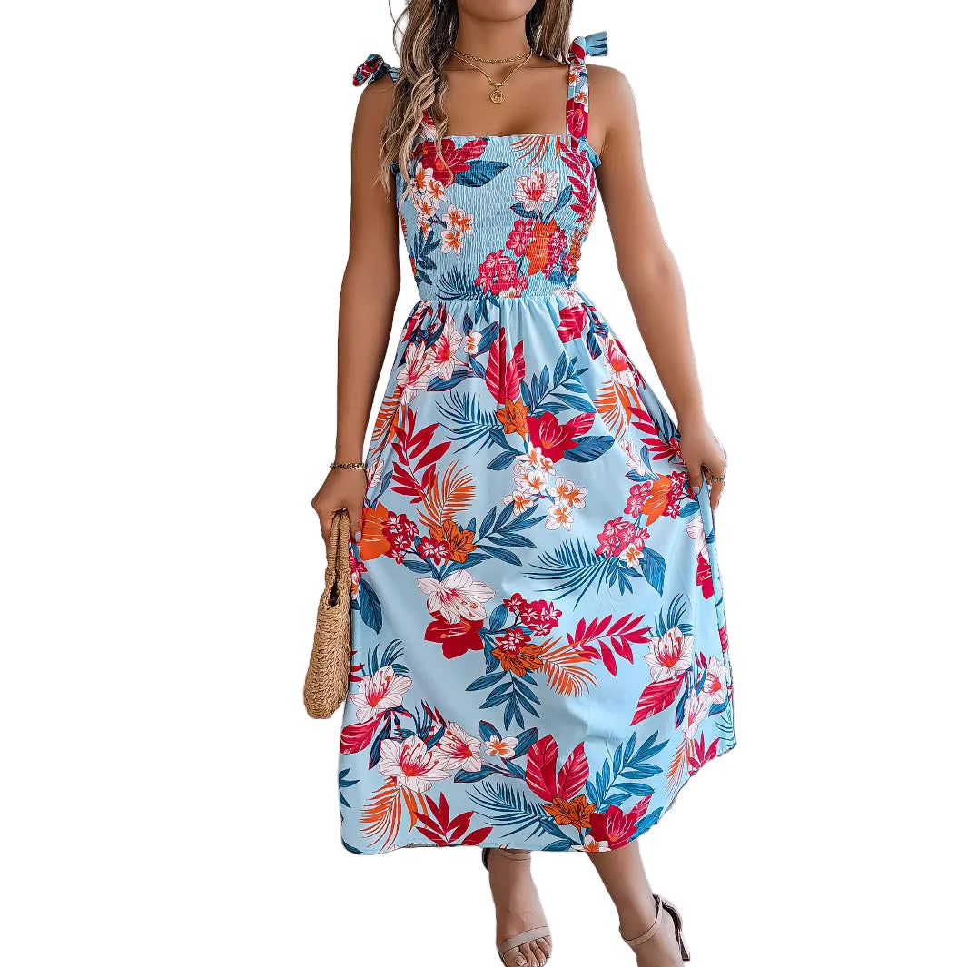 Close-up of smocked corset bodice on tropical floral midi dress with tie strap detail
