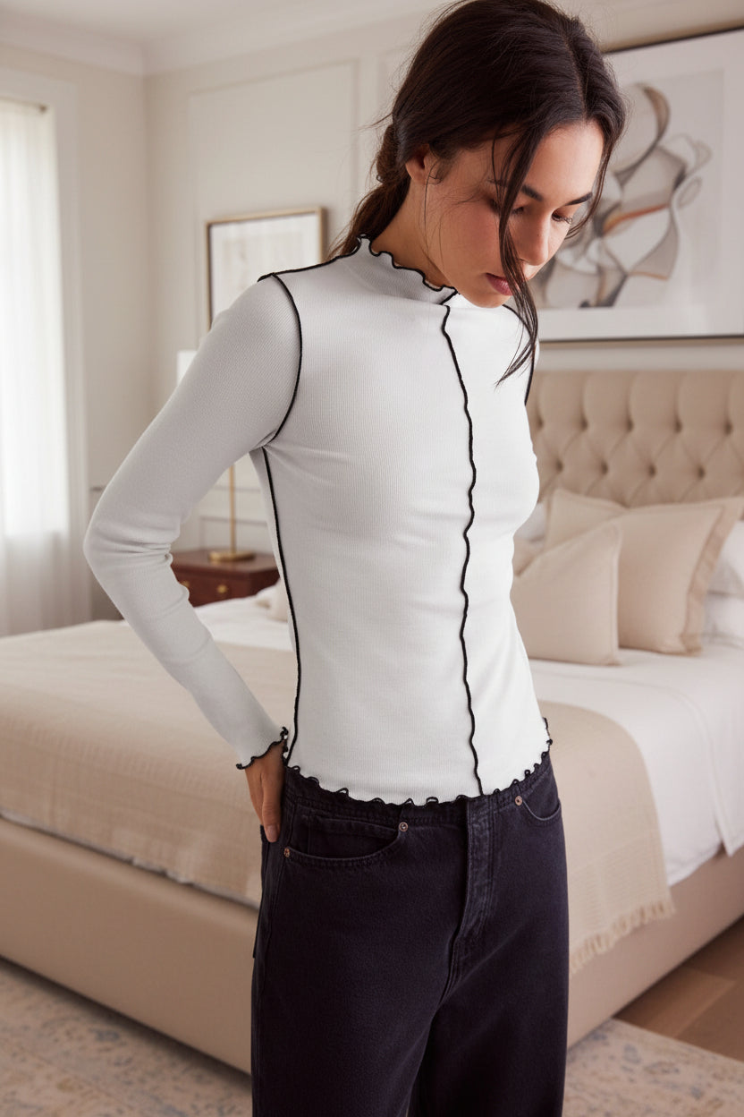 Fitted white and black top with white edges - long sleeve ribbed shirt for versatile everyday wear
