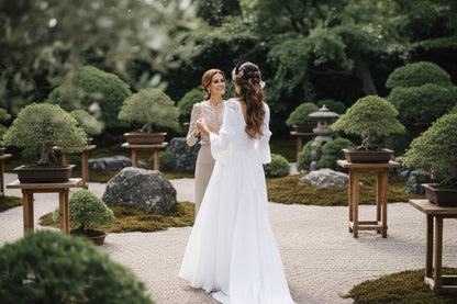 vory white lace bridal dress with nine-quarter sleeves and fitted bodice
