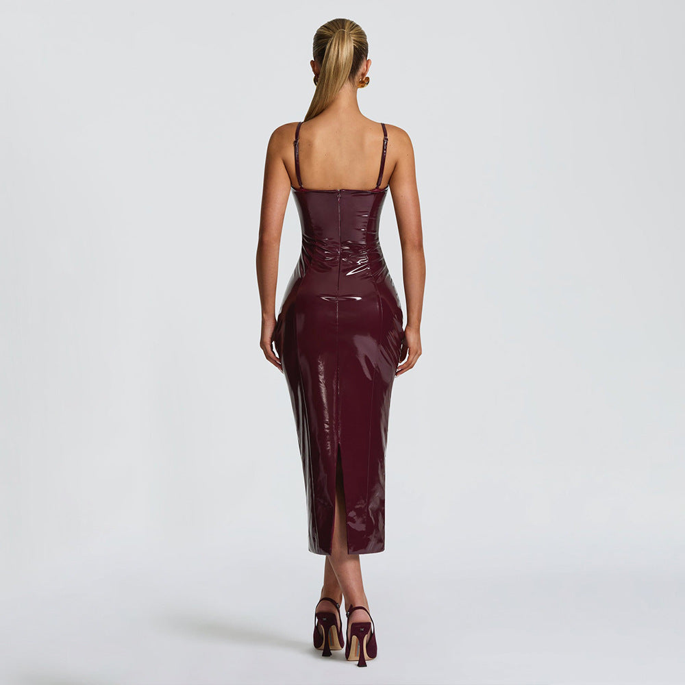 Back of a woman wearing a burgundy patent leather dress 