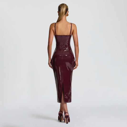 Back of a woman wearing a burgundy patent leather dress 