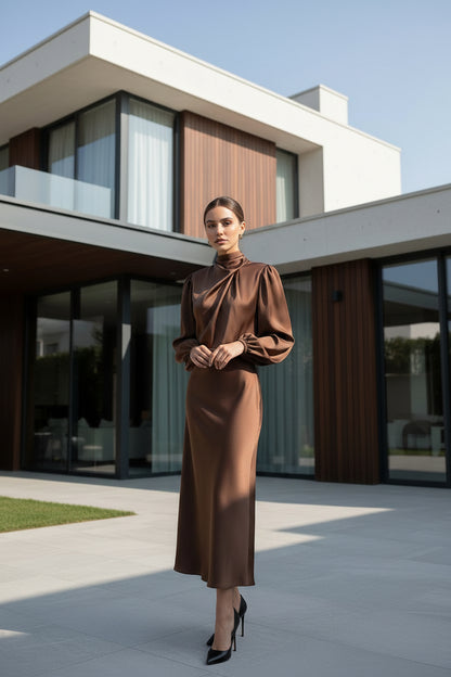 Satin lantern sleeve evening dress – styled look with pendant necklace and gold drop earrings
