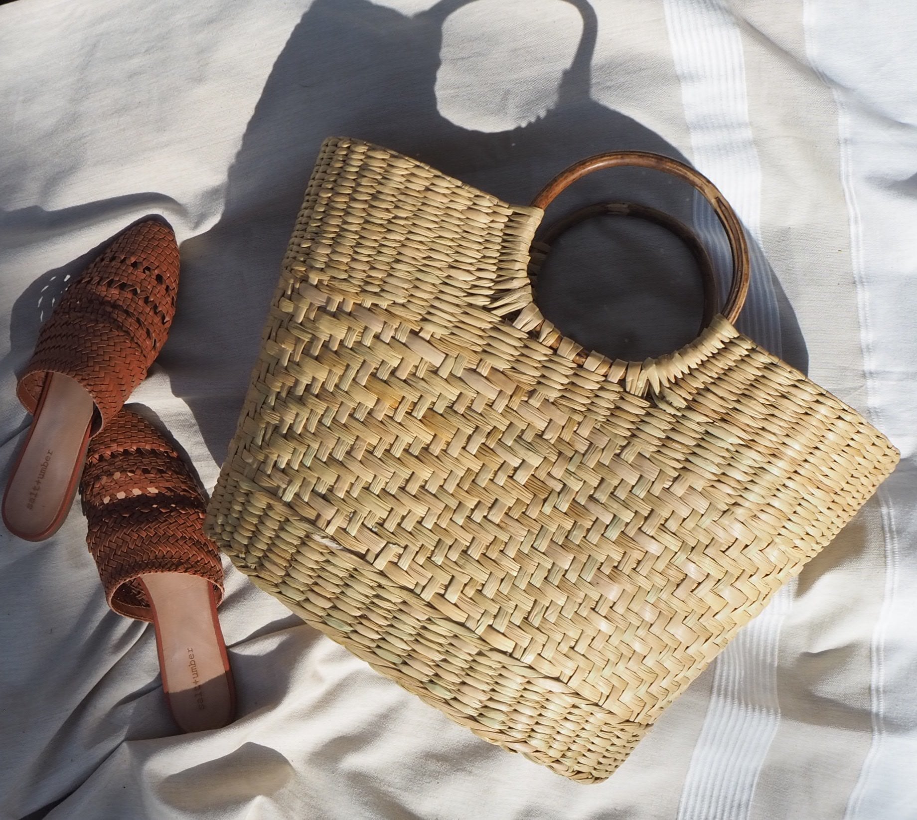 Woven handbag and brown sandals 