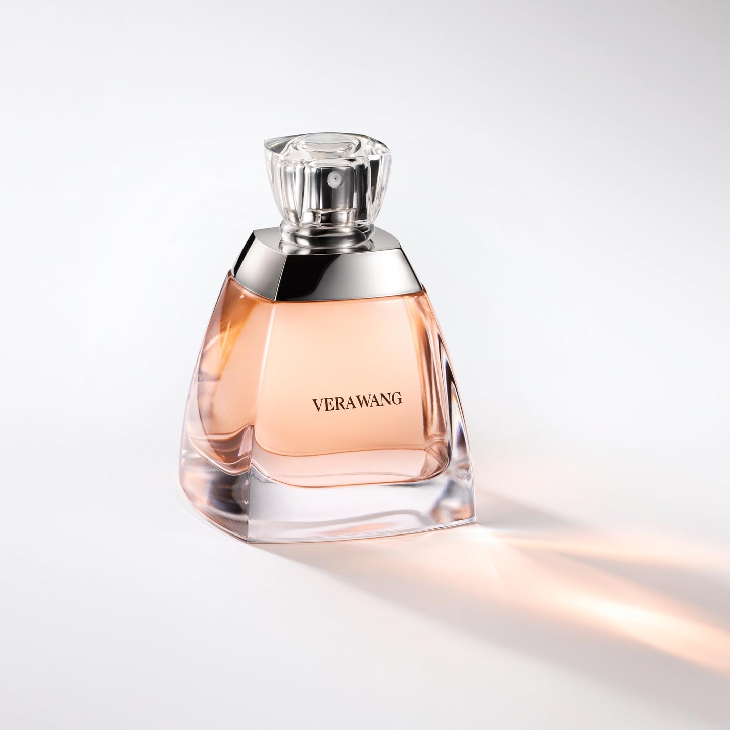 Vera Wang perfume bottle on a light gray background