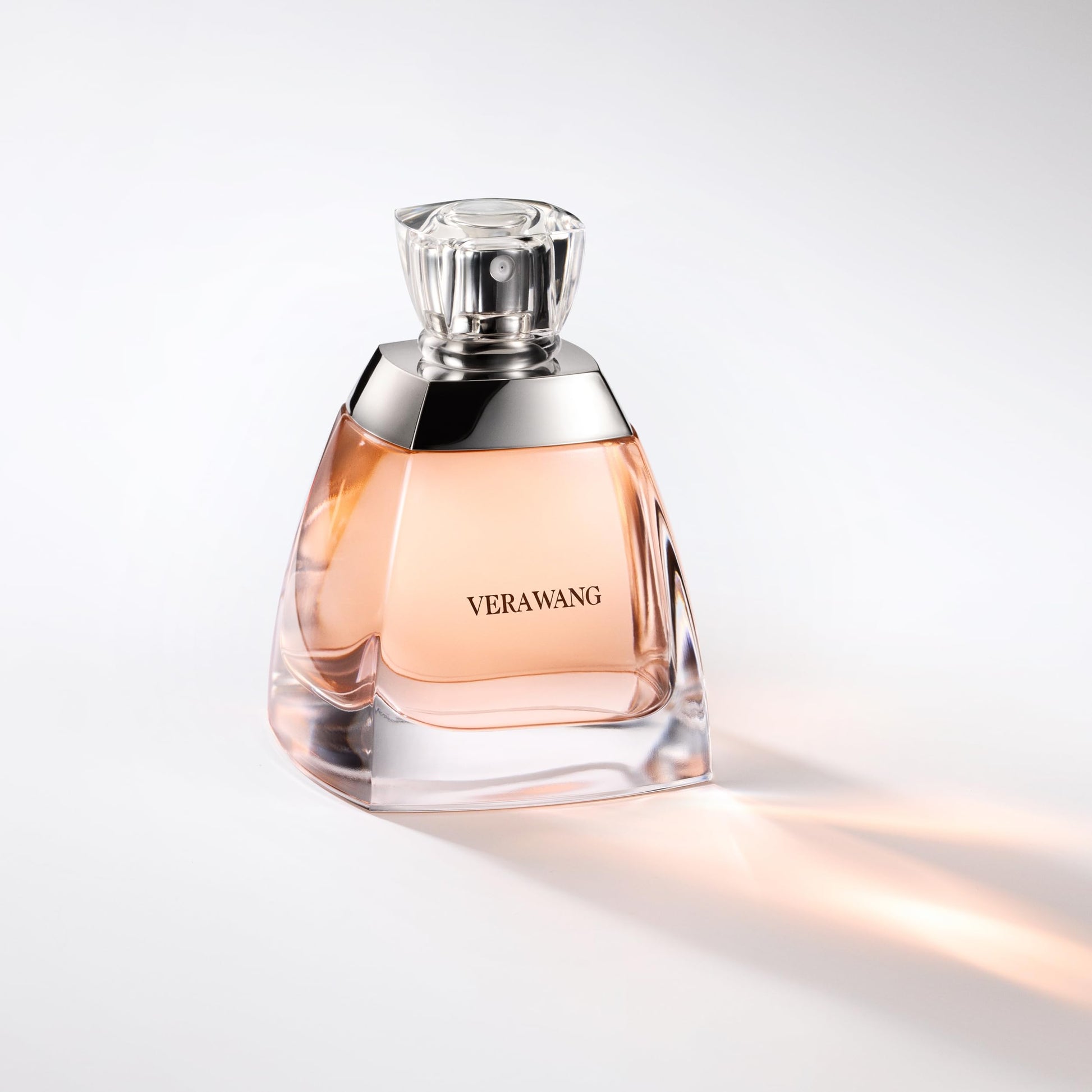 Vera Wang perfume bottle on a light gray background