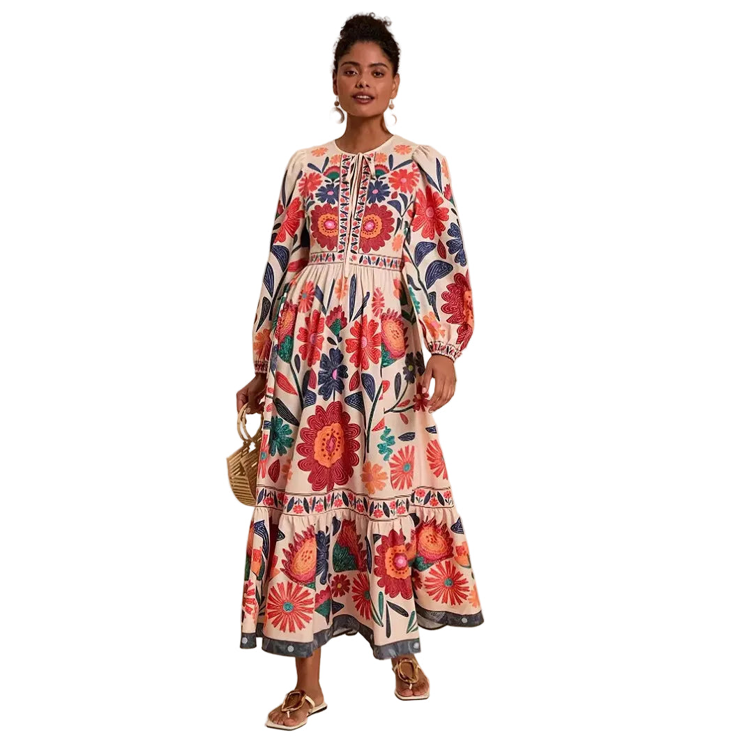 Woman wearing a floral boho maxi dress with long balloon sleeves and a tiered skirt