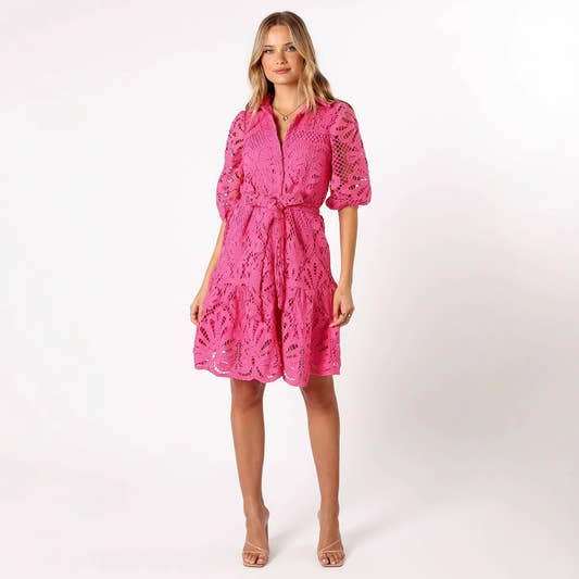 Woman wearing a pink lace dress 