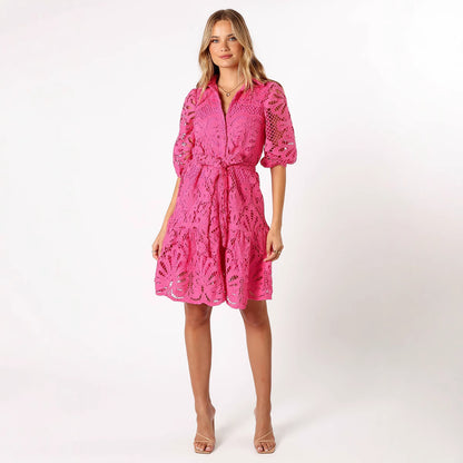 Woman wearing a pink lace dress 