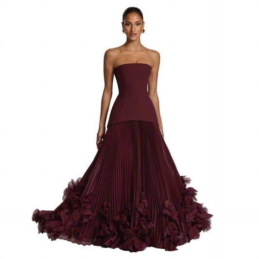 Structured Strapless Bodice Gown with Deep Accordion-Pleated Skirt and Floral Petal Hem Trim
