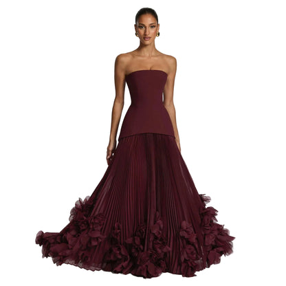 Structured Strapless Bodice Gown with Deep Accordion-Pleated Skirt and Floral Petal Hem Trim
