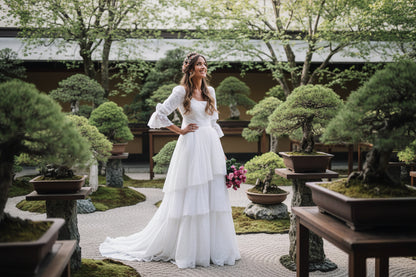 Long sleeve lace wedding dress in ivory white with intricate lace detailing

