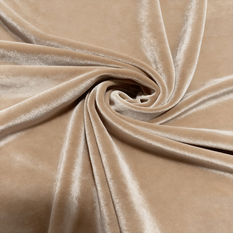 Close-up of beige velvet fabric with a swirl pattern