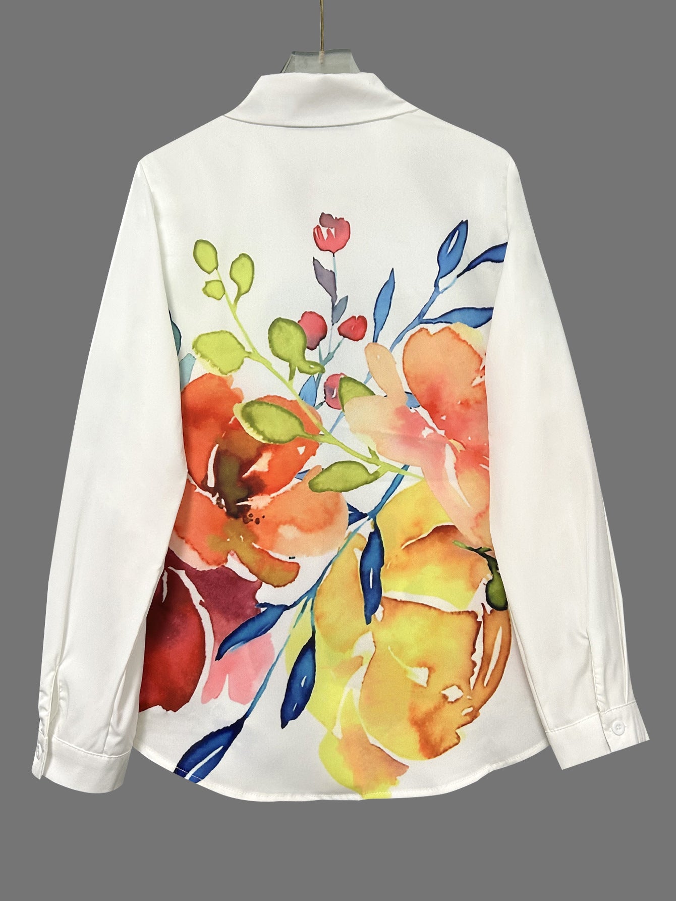 Watercolor floral print blouse in white with button-front closure and loose fit

