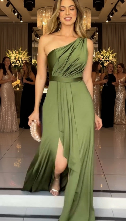 Woman wearing elegant formal dress with asymmetric neckline and thigh slit

