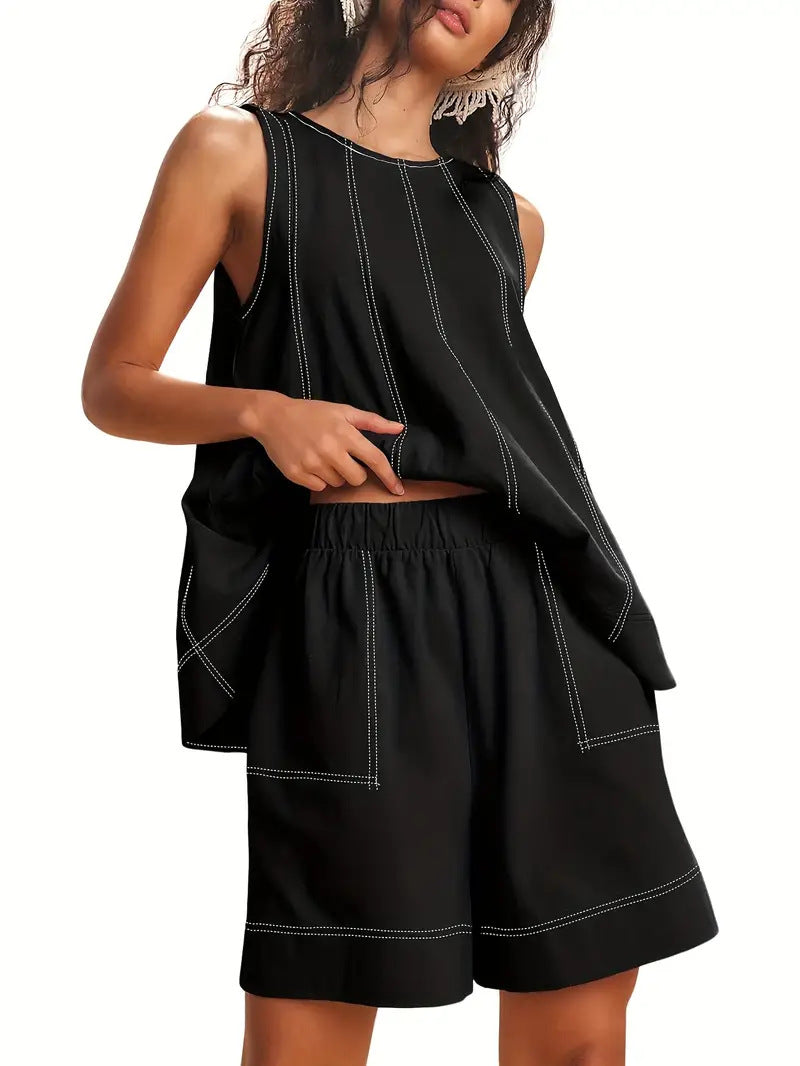 Two-piece lounge set in black – close-up of sleeveless tank top and shorts with pockets detail
