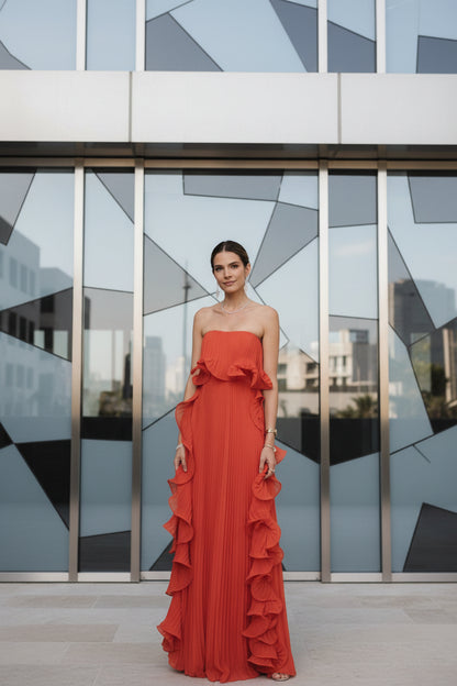 Orange red strapless pleated ruffle maxi dress – front view, ruffled chest wrap overlay and floor-length silhouette
