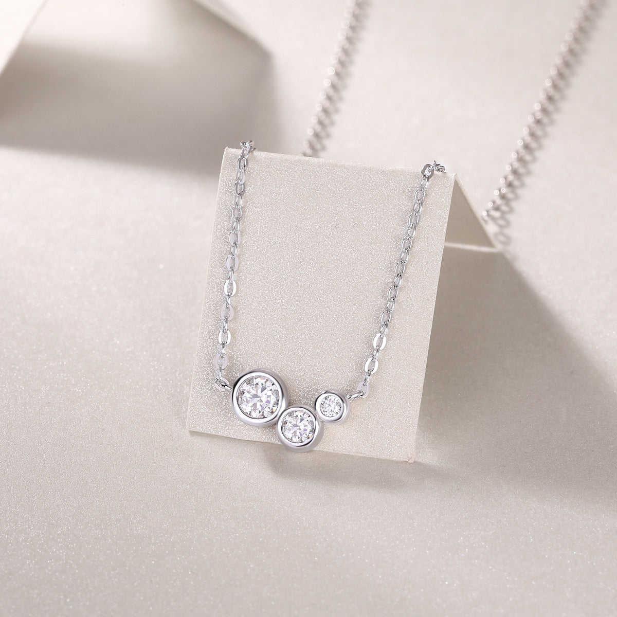 Silver necklace with three round diamonds 
