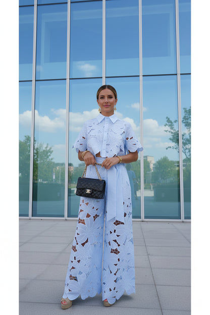 Person wearing a blue lace outfit  set