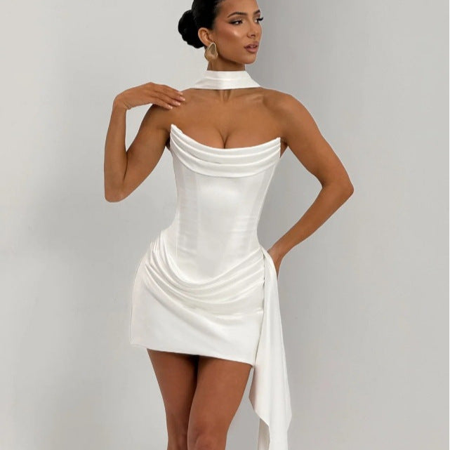 White satin fishtail dress showing structured bodice and asymmetrical drape,