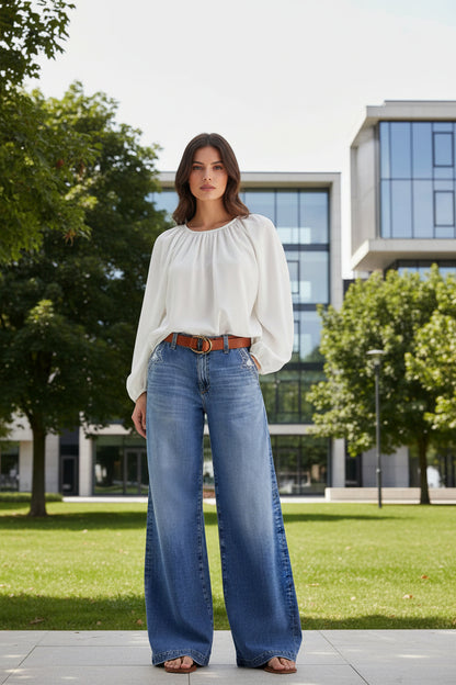 Blue wide leg denim jeans with embroidery detail  front view
