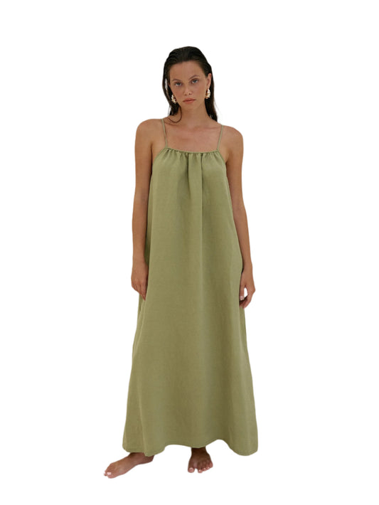 woman wearing a casual long  linen green dress