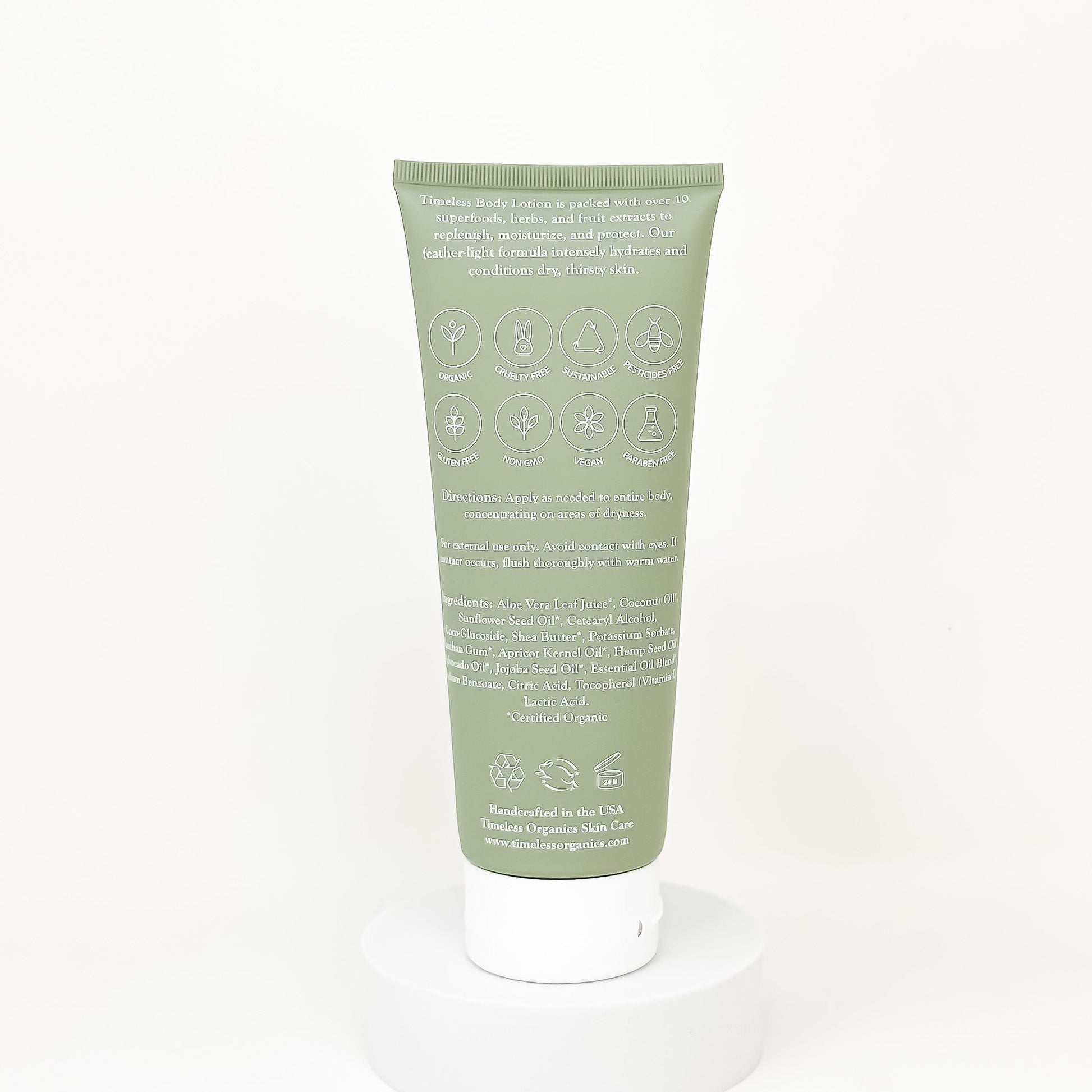 Back of Green tube of skincare product with text 