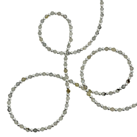 Beaded necklace with gray beads on a white background