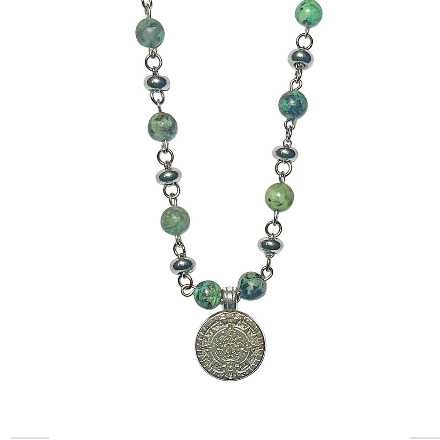 Necklace with green beads and a silver pendant on a white background