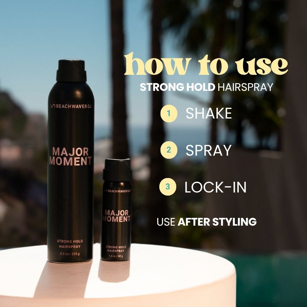 Two bottles of 'Major Moment' hairspray with usage instructions