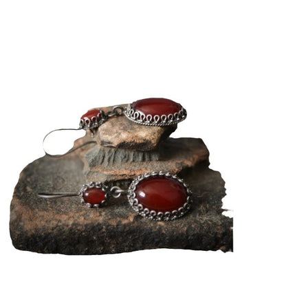 Jewelry set with red stones and silver accents 