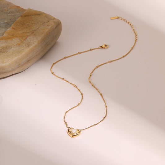 Gold necklace with a heart-shaped pendant 