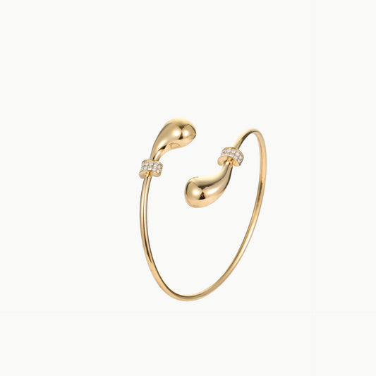 Gold bangle with small diamond-like stones